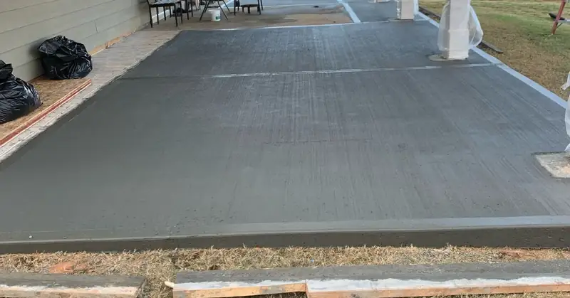 Broom-finish concrete patio slab off a covered porch