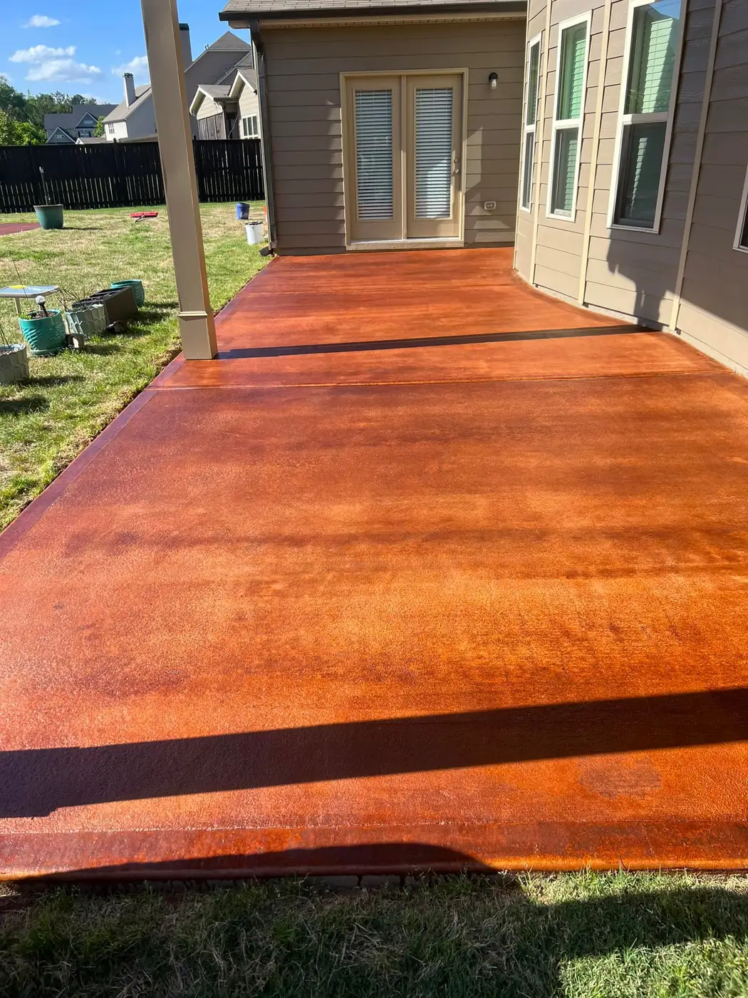 Stained concrete patio under a covered porch